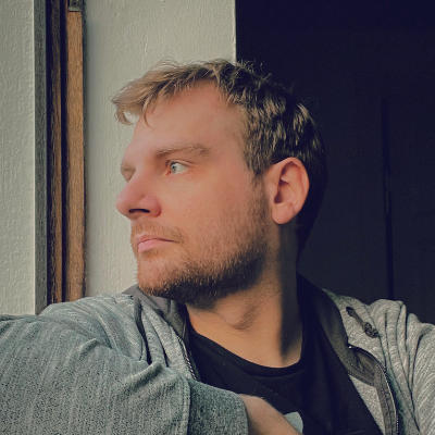 Photo of me (white male, blond-ish short hair, short beard) looking sideways